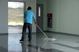 Man Dust Mopping