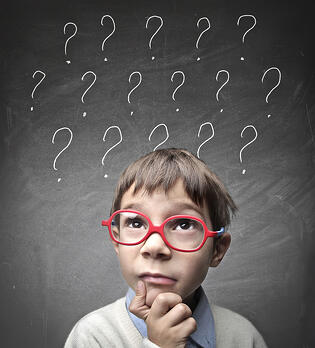 bigstock-Child-with-many-question-marks-40193056