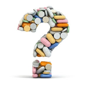 bigstock-Pills-as-question-on-white-iso-53360449