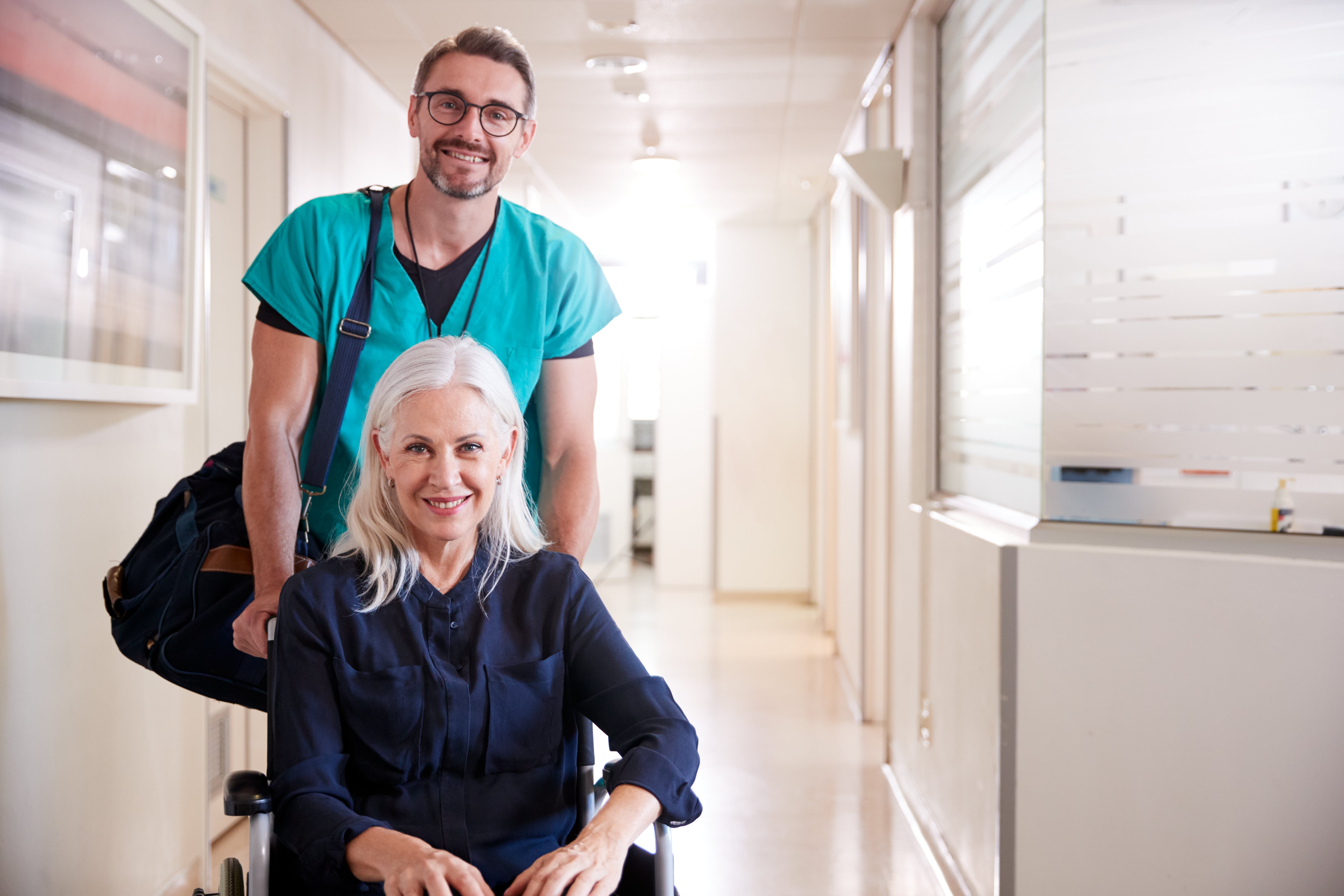 Hospital patient being discharged by friendly clinical staff