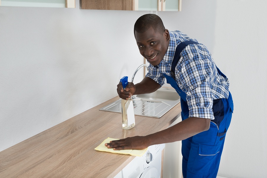 bigstock-Janitor-Cleaning-Kitchen-Workt-94942196.jpg